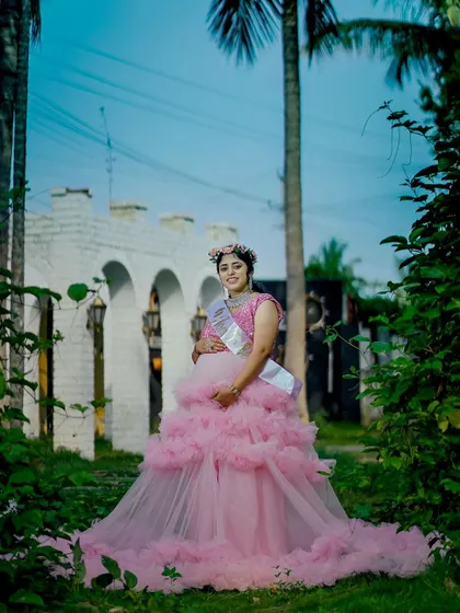 Our pink ruffle gown is a popular choice for maternity shoots and baby showers.