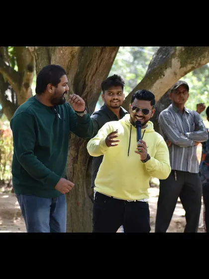 Sharing a laugh with participants during a team building game. It's these genuine, unscripted moments that make an event truly memorable.