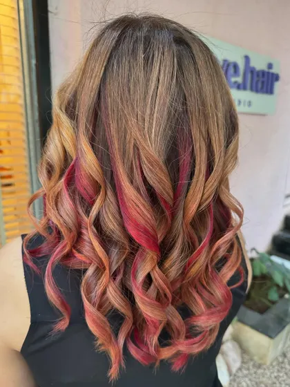 Flaming with style. This non-bleach color combines blonde with pops of fiery red for a unique look. (No filter)