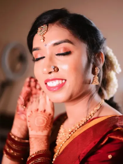 A beautiful, happy close-up of Lavanya. Her skin is glowing, and the natural-toned makeup enhances her features beautifully.