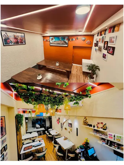 Our dining space is designed to be cozy and intimate. The top image shows our traditional low-seating area for a more authentic experience, while the bottom image gives a view of the main dining floor, decorated with greenery and warm lighting.