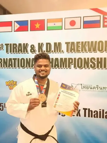 Coach Prabakaran celebrating his international medal win for India.