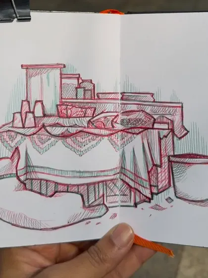 Here is a photo of me holding the sketch of the food stall. It shows the drawing in my hand, giving a sense of scale and the handmade quality of the work.
