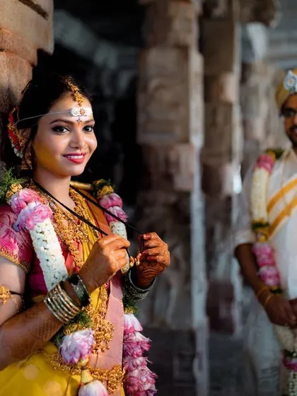 A duplicate of image 491, a beautiful bridal portrait with the groom in the background.