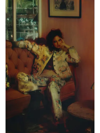 A quiet, contemplative moment from "Love in Future Past." The soft lighting and relaxed pose suggest a pause in the character's journey between past and future, a rare glimpse of the present.