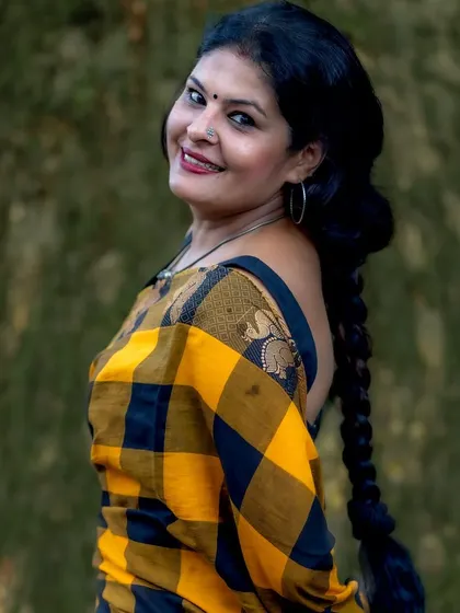 A beautiful portrait in the Kanchi cotton saree, with my hair braided and a smile. This look is a testament to the power of simplicity in ethnic wear.