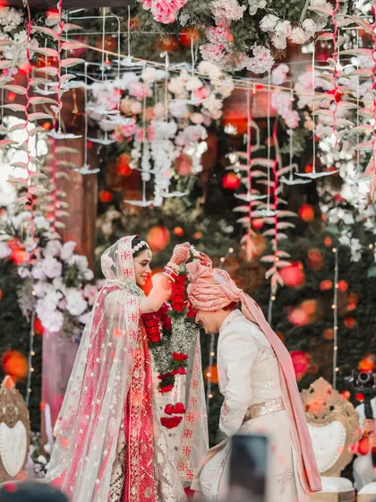 The varmala exchange is one of the most playful and joyous parts of the ceremony. I love capturing these candid interactions between the couple.