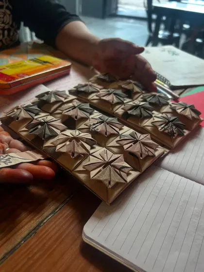 These intricate origami modules are the result of patience and precision. They are a stunning visual representation of how simple folds can combine to create complex geometric structures, blending art and mathematics perfectly.