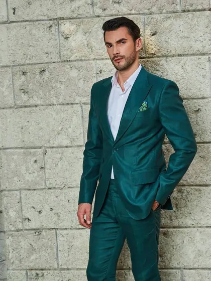 A final shot of the green linen suit, showcasing its sharp peak lapels and tailored fit. Experience the luxury of my bespoke summer collection.