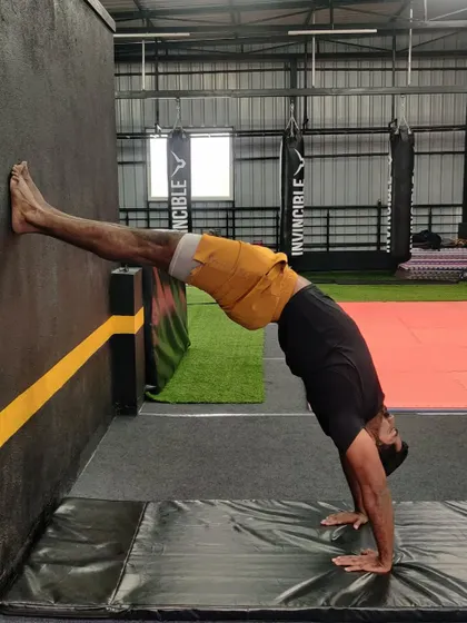 Using the wall is an excellent way to build strength and confidence in your backbends and handstands. This drill helps with shoulder and spinal flexibility.