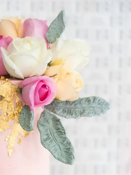 A top-down view showing the beautiful floral arrangement and gold leaf accents.