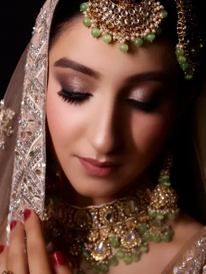 A close-up portrait of this modern bridal fusion look. The soft smokey eye and nude lip create a sophisticated and elegant feel.