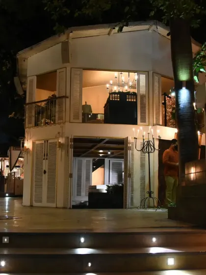 The two-story structure at the heart of our restaurant, offering private dining spaces with a view. The architecture is designed to feel like a Mediterranean villa.