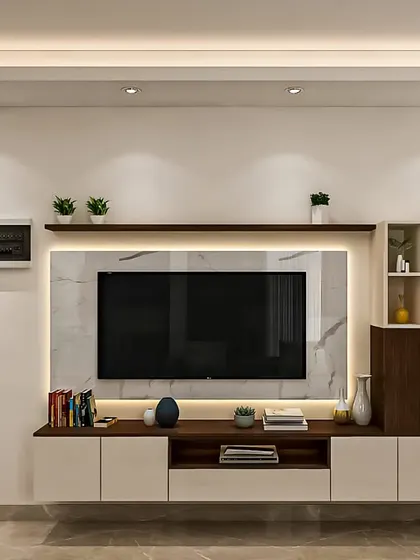 A minimalist TV unit with a backlit marble panel as the centerpiece. The console combines white cabinets with a central wood section and is flanked by an asymmetrical shelving unit for display.