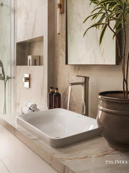 This bathroom is a serene sanctuary. I used marble-look tiles, a sleek vessel sink, and warm lighting to create a space that feels both minimalist and full of character. The addition of a plant brings a touch of nature indoors.