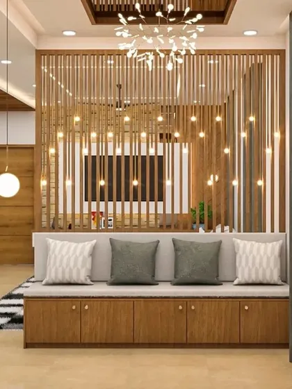 This elaborate wooden slat partition features integrated fairy lights, creating a magical ambiance. The long, low bench provides ample seating and storage, making it a stunning focal point.