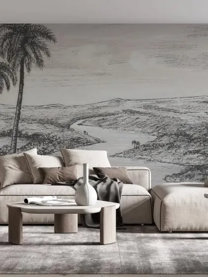 This black and white sketch-style landscape mural brings an artistic and expansive feel to a modern living room, proving that monochrome can make a powerful statement.