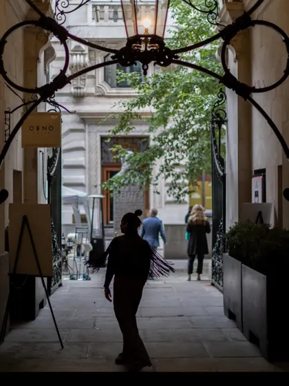 A silhouette of me, walking through a beautiful arched alleyway in London. Travel and architecture are constant sources of inspiration for my work.