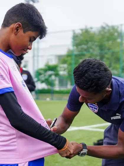 Another BFC player signs a jersey for a participant of our High-Performance Camp.