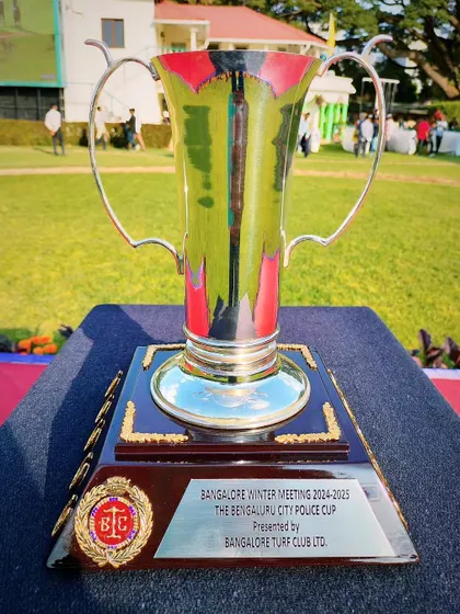 The Bengaluru City Police Cup, a tall and elegant silver trophy.
