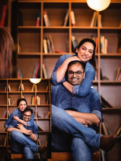 A fun and loving moment from their library-themed pre-wedding shoot. Her arms wrapped around him shows their deep connection and comfort with each other.