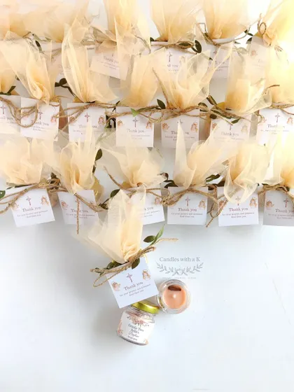 Beautifully packaged mini jar candles with a cinnamon vanilla scent, created as Baptism return gifts for a client in Hyderabad.