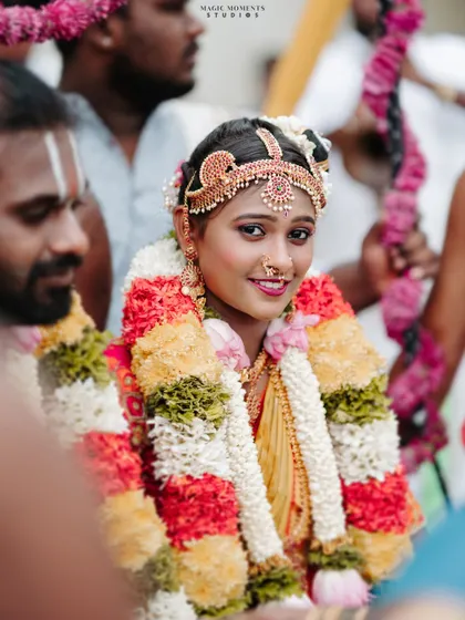 A beautiful close up portrait of the bride, Shrivalli, looking radiant during her wedding ceremony.