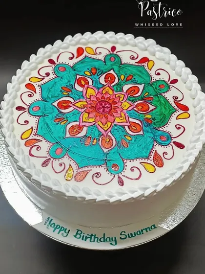 I believe cakes can be art. This cake features a vibrant, hand-painted Mandala design, turning a simple white canvas into a beautiful, edible masterpiece for a truly unique celebration.