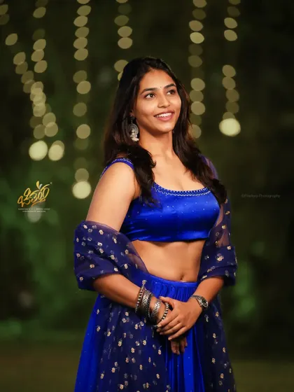 Capturing the natural smile and energy of actress Sapthami Gowda at an awards event. The soft, ambient lighting with a beautiful bokeh background makes this candid portrait feel both glamorous and genuine.