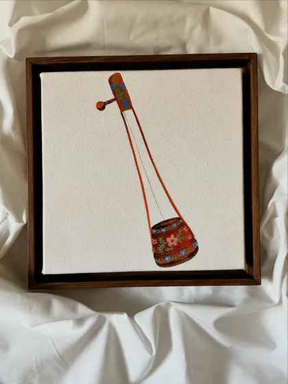 A miniature painting of an Ektara, a single-stringed instrument, from 'The Twenty-Fifth Note' collection. The detail in the small canvas celebrates the beauty of traditional instruments.