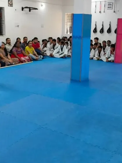Two students demonstrate an impressive high kick.