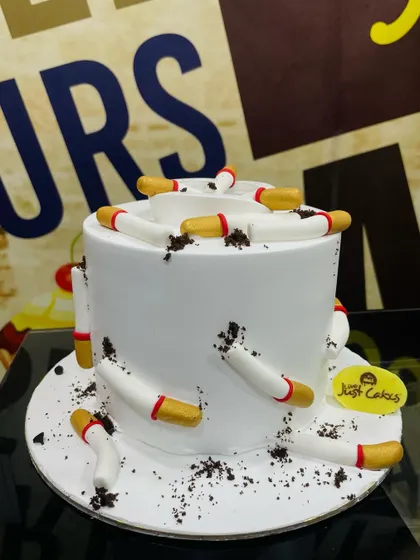 A unique 1kg novelty cake designed to look like an ashtray with edible cigarettes, showcasing our ability to tackle any theme.