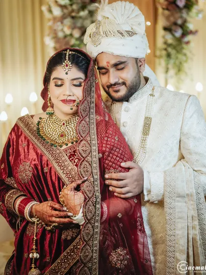 An intimate and emotional portrait of the couple. The soft lighting and their gentle embrace create a feeling of warmth and deep affection.