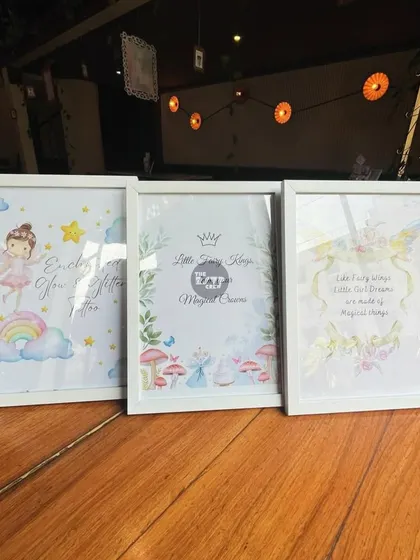 Three beautifully framed prints with fairy illustrations and sweet quotes, perfect for an enchanted party theme.