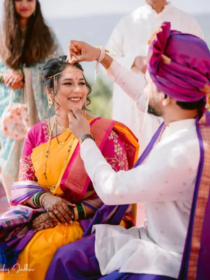 The groom applying sindoor, a beautiful and significant ritual.