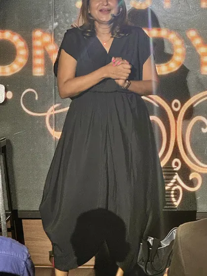 A candid shot of me on stage, interacting with the crowd during my stand-up set.