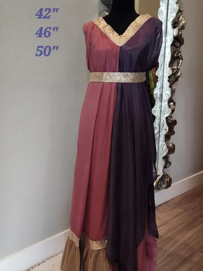 This dual-toned fusion dress creates a beautiful, flowing silhouette. The design combines two complementary colors with a gold-embroidered belt and neckline, offering a goddess-like drape that is perfect for parties and special occasions.