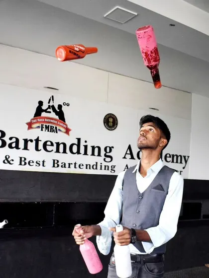 A professional flair bartender mid-performance, showcasing the dynamic and engaging entertainment we bring to any event.
