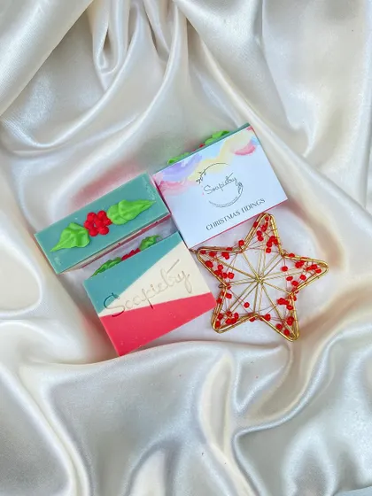The Christmas Tidings soap, perfect for gifting. The design is inspired by classic holiday decorations.