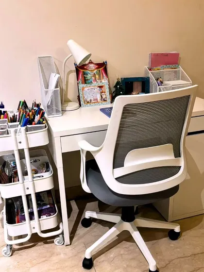 This organized kid's desk setup is designed to fuel imagination. With a craft caddy for supplies and neat file folders for schoolwork, this space proves that structure and creativity can go hand in hand.