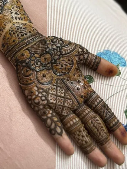 This is a detailed view of my intricate bridal henna work. Each design is unique, combining traditional patterns like paisleys and mandalas with fine-line fillers to create a stunning, full-coverage look for your special day.