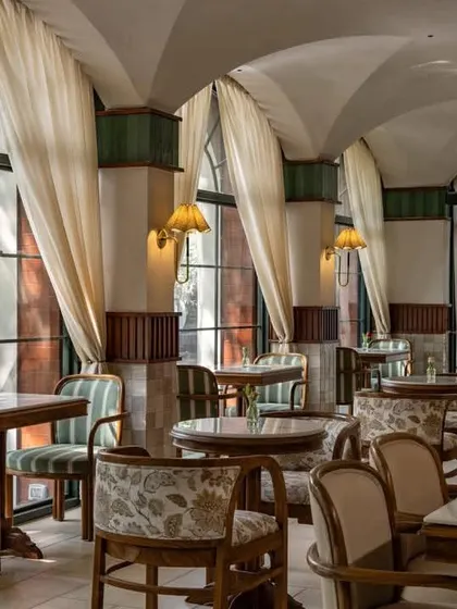 'Cafe Wink' in New Delhi by Studio Dangg reinterprets a classic Italian trattoria with soft arches, vaulted ceilings, and a warm, inviting atmosphere.