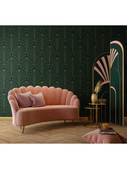 A bold, art-deco inspired design. The deep green patterned wallpaper and a scalloped pink velvet sofa create a glamorous and theatrical look, showcasing our ability to work with vibrant styles.