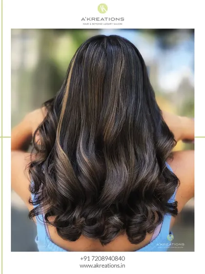 A back view of the mushroom brown highlights, styled into soft waves to show off the beautiful dimension.