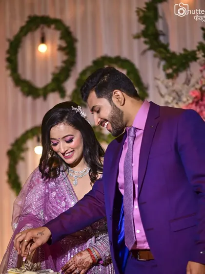 A happy, candid moment of the couple cutting their engagement cake. These are the sweet, celebratory moments we love to capture.