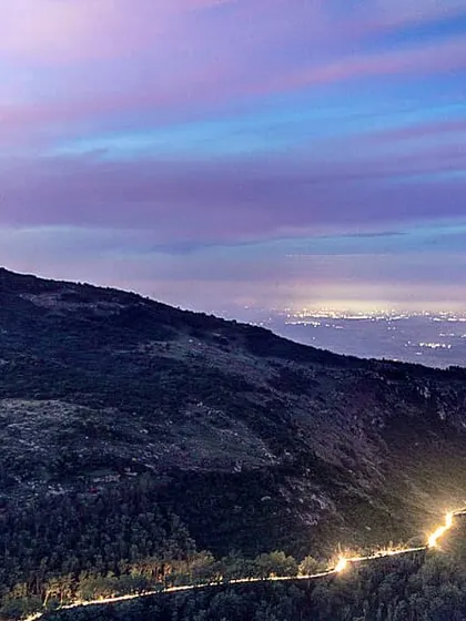 This is a long exposure shot of Nandi Hills after sunset. I wanted to capture the winding road lit by car lights, contrasting with the dark hill and the colorful twilight sky. It shows how a landscape completely changes at night.