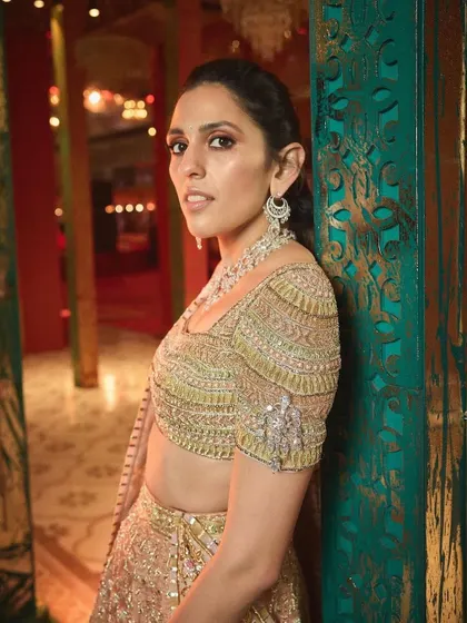 A close-up of the heavily embellished blouse. The craftsmanship in this Abu Jani Sandeep Khosla piece is simply breathtaking.