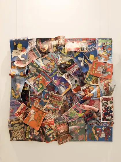 'Comic Confluence' by Hitesh G. This acrylic wall installation is a tribute to the artistry and legacy of comic books, featuring a dynamic collage of classic comic covers.