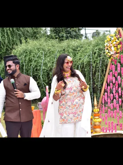 A happy bride makes a happy emcee! Sharing a laugh with the bride during her fun-filled Haldi.