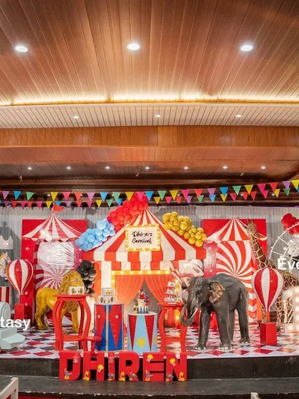 Step right up to Dhiren's grand carnival party. This vibrant indoor stage is filled with classic carnival elements, including a red and white striped big top, a carousel, a Ferris wheel, and friendly animal props, creating an atmosphere of fun and excitement for everyone.